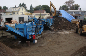 Crushing equipment and material piles at the A. Vitti recycling yard